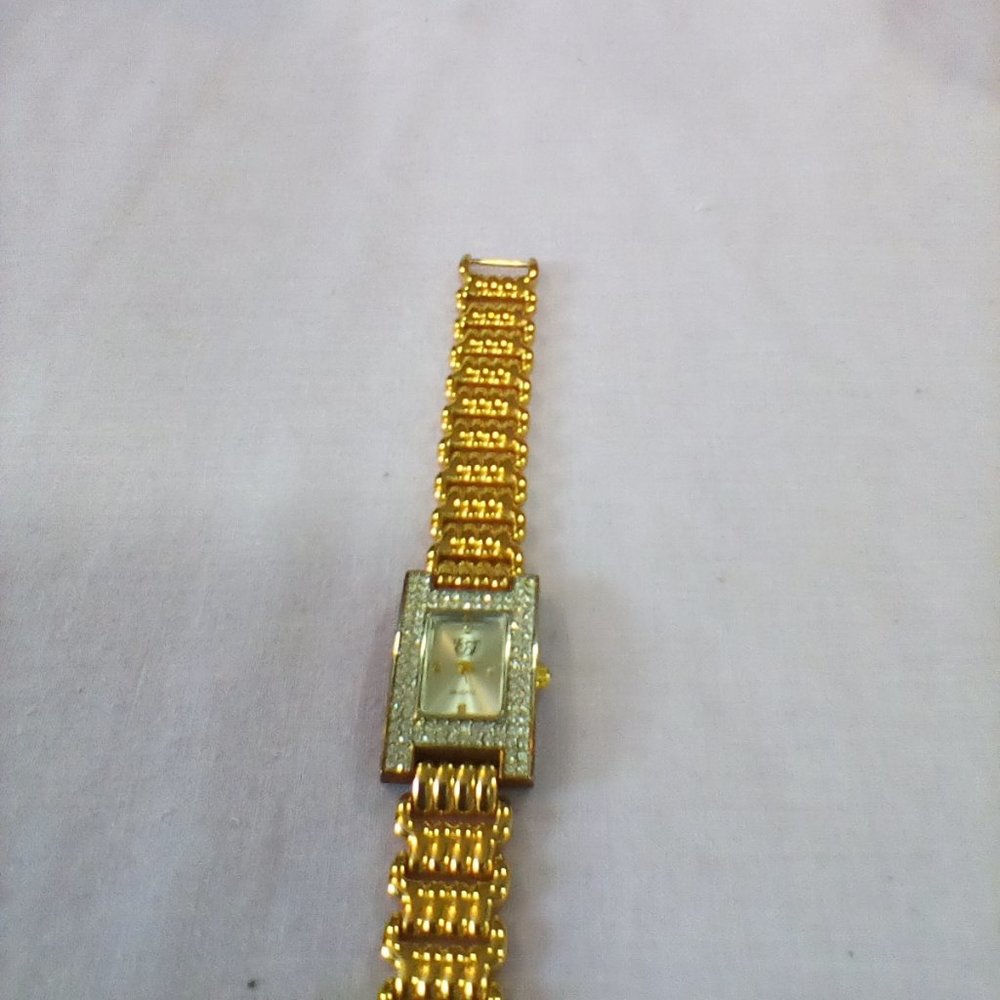 EJ Fashion Gold Tone with Rhinestones quart watch. Still has plastic on the back